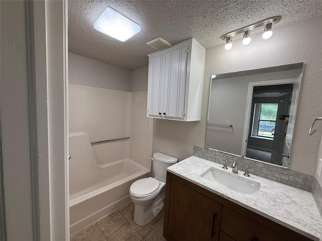1213 Dreessen Dr, Moore, OK 73160 - full bath with vanity, tile patterned floors, a textured ceiling, shower / bath combination, and a textured wall