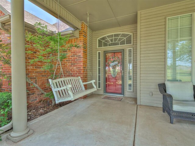 1810 Sandpiper Dr, Blanchard, OK 73010 - view of exterior entry featuring covered porch and brick siding