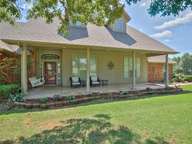 1810 Sandpiper Dr, Blanchard, OK 73010 - back of house with a shingled roof, a lawn, and covered porch
