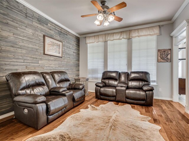 1810 Sandpiper Dr, Blanchard, OK 73010 - living room with ornamental molding, a ceiling fan, wood finished floors, and wood walls
