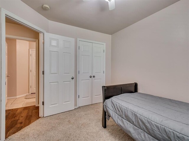 1810 Sandpiper Dr, Blanchard, OK 73010 - bedroom featuring a closet, a ceiling fan, and wood finished floors