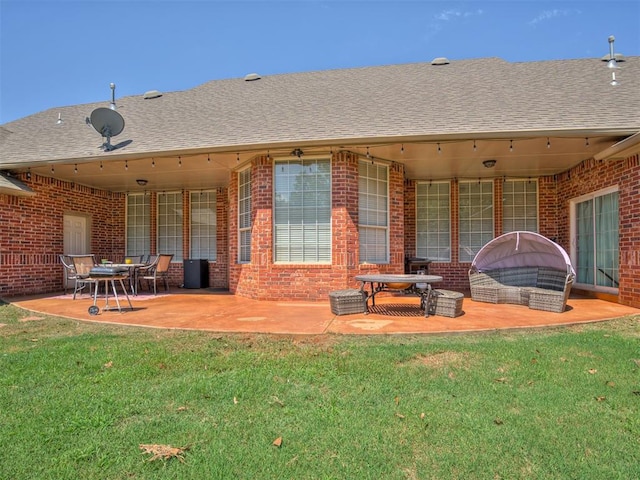 1810 Sandpiper Dr, Blanchard, OK 73010 - rear view of house with brick siding, a patio, a yard, and roof with shingles