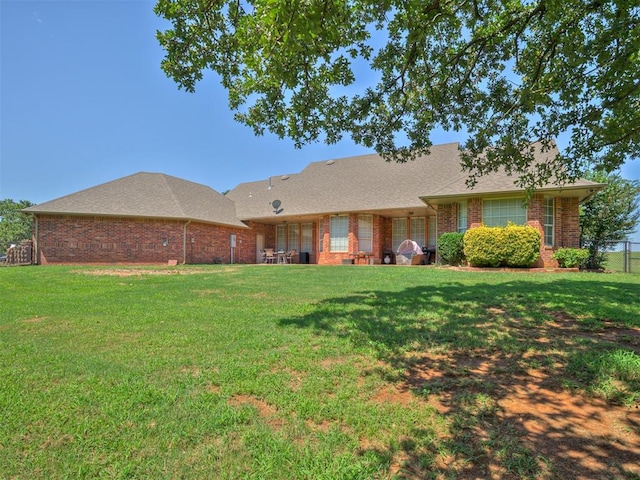 1810 Sandpiper Dr, Blanchard, OK 73010 - rear view of house with brick siding