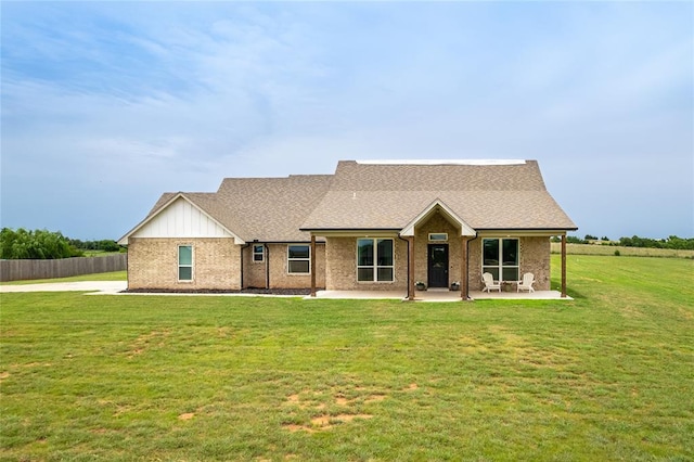 2326 County Road 1335, Blanchard, OK 73010 - view of front facade featuring a patio, brick siding, roof with shingles, and board and batten siding