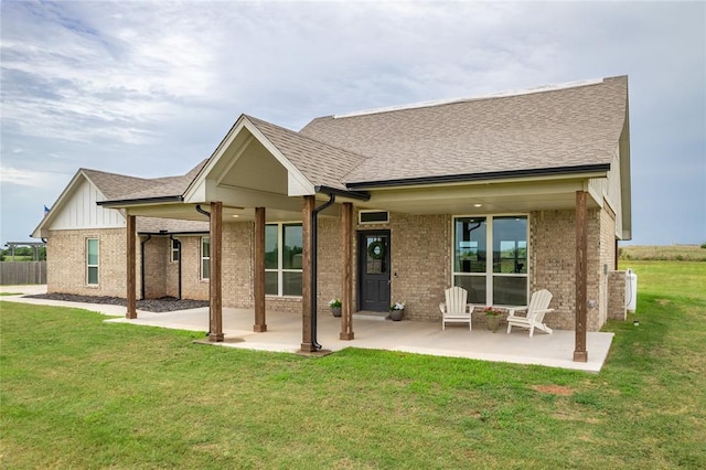 2326 County Road 1335, Blanchard, OK 73010 - rear view of property featuring brick siding, a patio, and a shingled roof