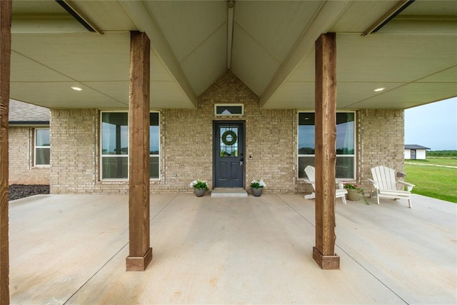 2326 County Road 1335, Blanchard, OK 73010 - doorway to property with brick siding and a patio area