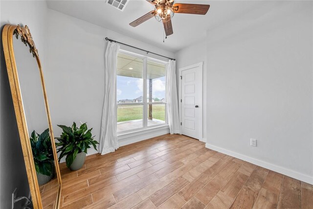 2326 County Road 1335, Blanchard, OK 73010 - unfurnished room with ceiling fan and wood finished floors
