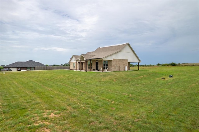2326 County Road 1335, Blanchard, OK 73010 - back of house featuring a yard and brick siding