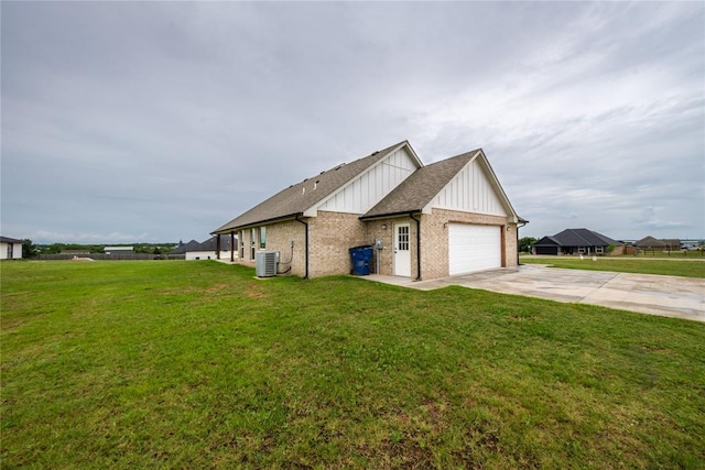 2326 County Road 1335, Blanchard, OK 73010 - view of property exterior with board and batten siding, concrete driveway, brick siding, an attached garage, and a yard