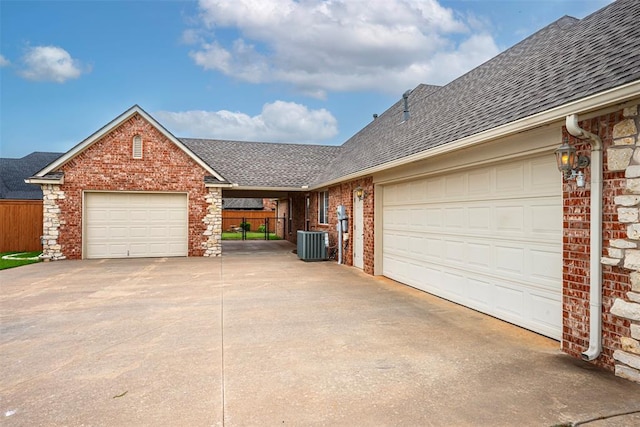 1865 Buckskin Ct, Blanchard, OK 73010 - view of front of house featuring roof with shingles, concrete driveway, brick siding, and a garage