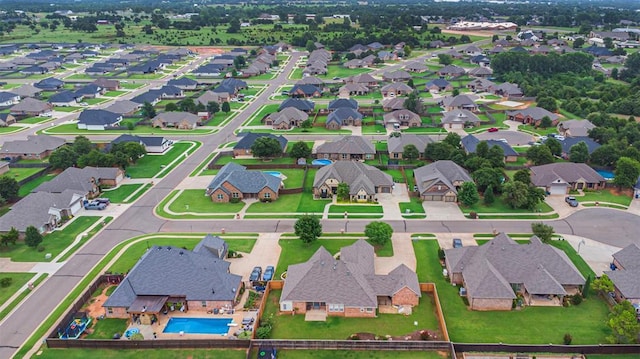 1865 Buckskin Ct, Blanchard, OK 73010 - aerial view of property and surrounding area featuring nearby suburban area and a pool area