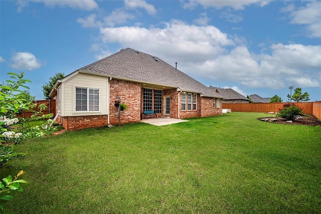 1865 Buckskin Ct, Blanchard, OK 73010 - rear view of house featuring brick siding, a fenced backyard, a patio, and roof with shingles