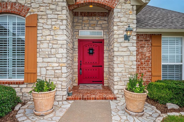 1865 Buckskin Ct, Blanchard, OK 73010 - entrance to property featuring roof with shingles, stone siding, and brick siding