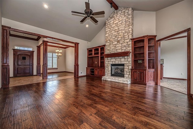 1865 Buckskin Ct, Blanchard, OK 73010 - unfurnished living room featuring a chandelier, hardwood / wood-style floors, a ceiling fan, a stone fireplace, and beam ceiling