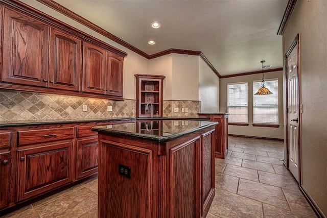 1865 Buckskin Ct, Blanchard, OK 73010 - kitchen with a center island, ornamental molding, decorative backsplash, stone tile floors, and a peninsula