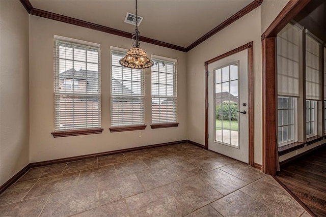 1865 Buckskin Ct, Blanchard, OK 73010 - unfurnished dining area featuring ornamental molding and dark stone finish floors