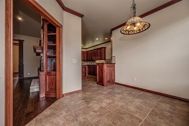 1865 Buckskin Ct, Blanchard, OK 73010 - kitchen featuring ornamental molding, tasteful backsplash, dark countertops, pendant lighting, and recessed lighting