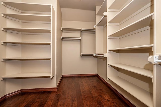 1865 Buckskin Ct, Blanchard, OK 73010 - spacious closet featuring dark wood-style floors