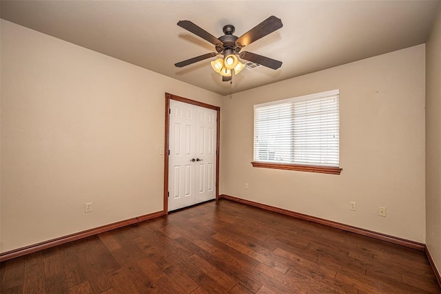 1865 Buckskin Ct, Blanchard, OK 73010 - empty room featuring dark wood finished floors and ceiling fan