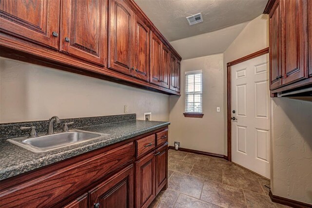 1865 Buckskin Ct, Blanchard, OK 73010 - laundry area with washer hookup, cabinet space, and bar with sink