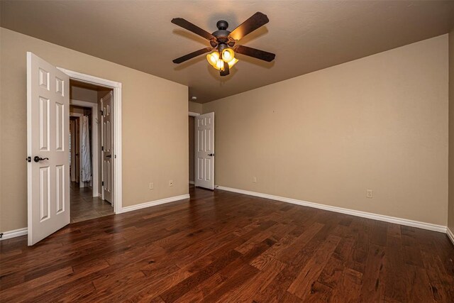 1865 Buckskin Ct, Blanchard, OK 73010 - unfurnished bedroom featuring dark wood-style floors and a ceiling fan