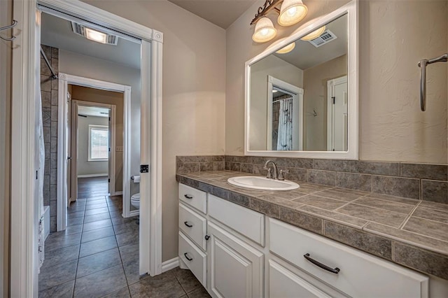 1865 Buckskin Ct, Blanchard, OK 73010 - full bathroom with vanity, curtained shower, and tile patterned flooring
