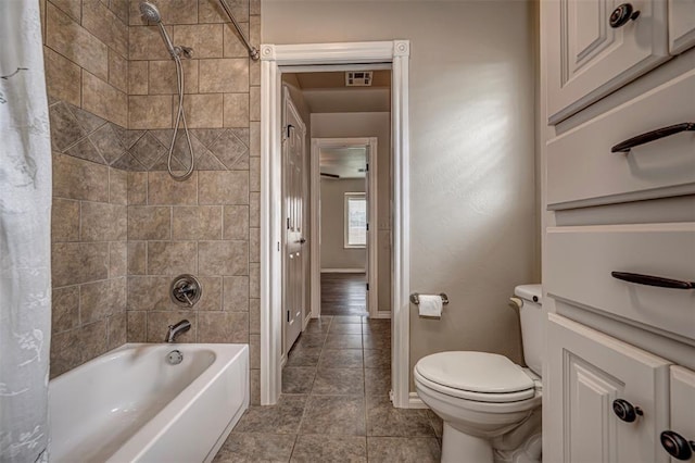 1865 Buckskin Ct, Blanchard, OK 73010 - full bathroom featuring shower / bath combo with shower curtain and tile patterned flooring