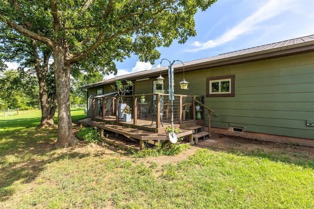 349760 E 970th Rd, Sparks, OK 74869 - rear view of property featuring a deck, a lawn, a metal roof, and crawl space