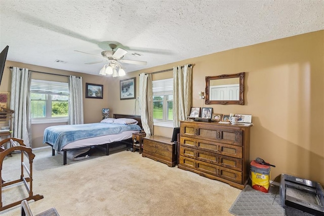 349760 E 970th Rd, Sparks, OK 74869 - bedroom featuring carpet floors, a textured ceiling, and a ceiling fan