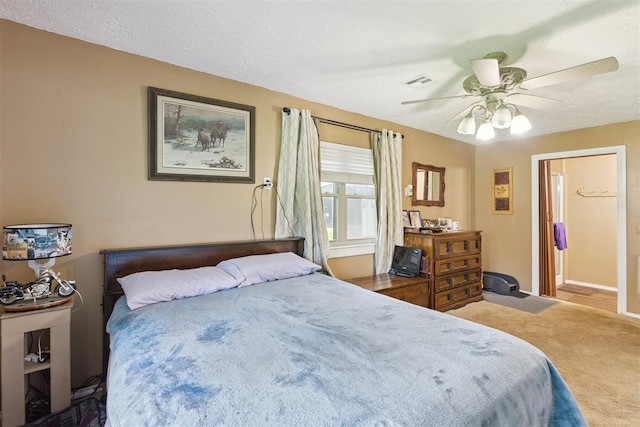 349760 E 970th Rd, Sparks, OK 74869 - bedroom featuring carpet floors, ceiling fan, and a textured ceiling
