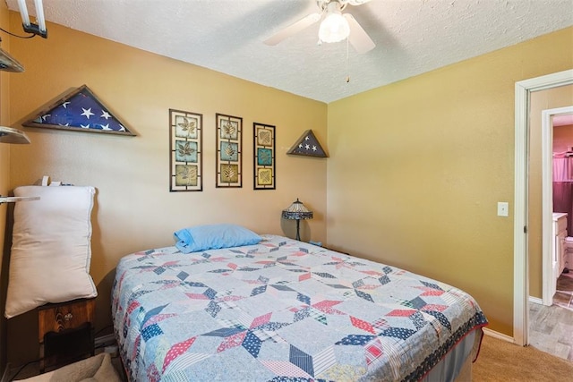 349760 E 970th Rd, Sparks, OK 74869 - carpeted bedroom featuring a textured ceiling and ceiling fan