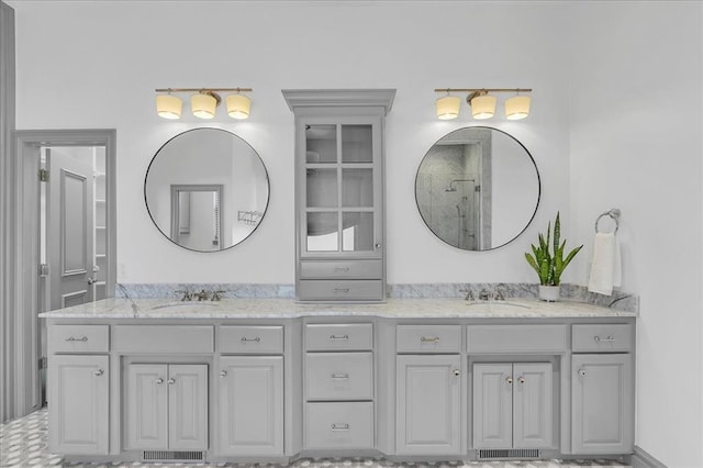 108 E Stroh Ave, Okarche, OK 73762 - bathroom featuring double vanity and a tile shower