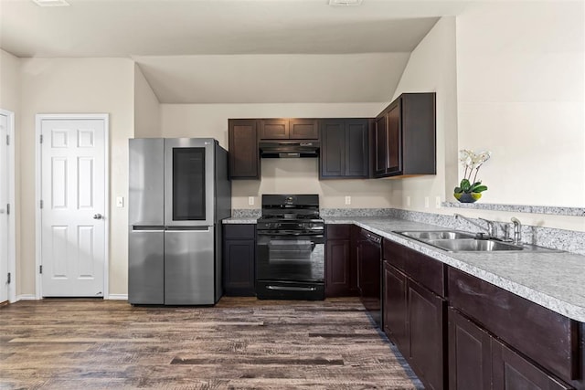 11501 Ruger Rd, Yukon, OK 73099 - kitchen with black appliances, exhaust hood, dark wood finished floors, light countertops, and dark brown cabinetry