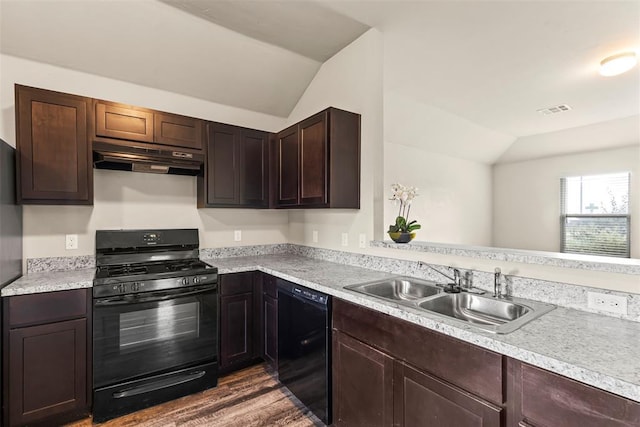 11501 Ruger Rd, Yukon, OK 73099 - kitchen featuring black appliances, lofted ceiling, under cabinet range hood, light countertops, and dark wood-type flooring