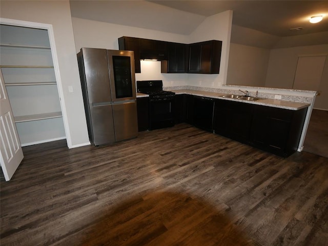 11501 Ruger Rd, Yukon, OK 73099 - kitchen with smart refrigerator, black gas range oven, dark wood-style flooring, light countertops, and lofted ceiling