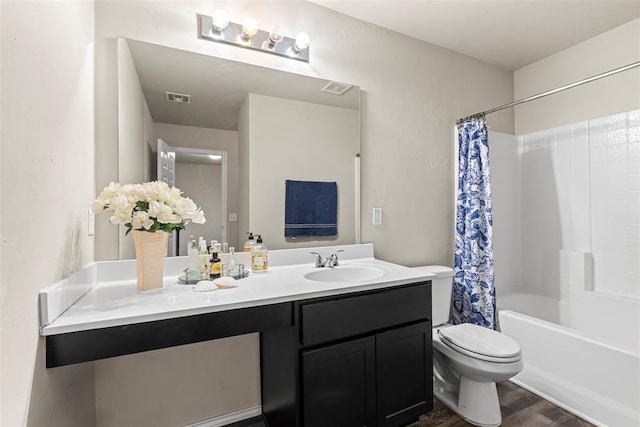 11501 Ruger Rd, Yukon, OK 73099 - bathroom with vanity, wood finished floors, and shower / tub combo
