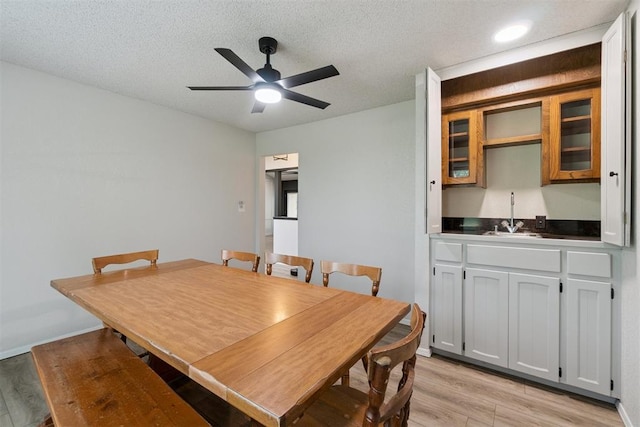 12073 N3540 Rd, Seminole, OK 74868 - dining room featuring a ceiling fan, light wood-type flooring, and a textured ceiling