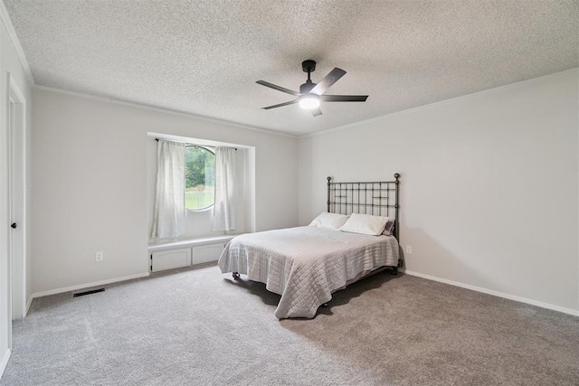 12073 N3540 Rd, Seminole, OK 74868 - bedroom with light colored carpet, ornamental molding, a textured ceiling, and a ceiling fan