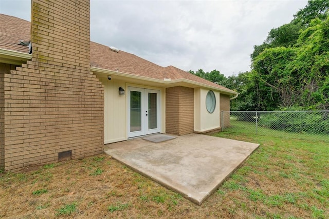 12073 N3540 Rd, Seminole, OK 74868 - back of property featuring french doors, brick siding, a patio, a chimney, and roof with shingles