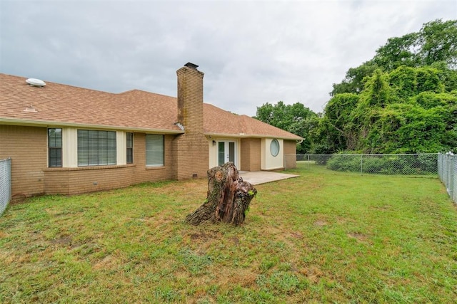 12073 N3540 Rd, Seminole, OK 74868 - rear view of property with a fenced backyard, a chimney, brick siding, a shingled roof, and a patio area