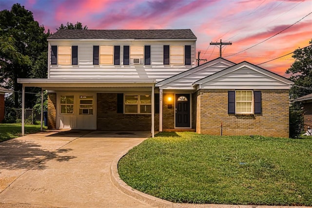 312 Jon St, Guthrie, OK 73044 - view of front facade featuring brick siding, a front lawn, and driveway