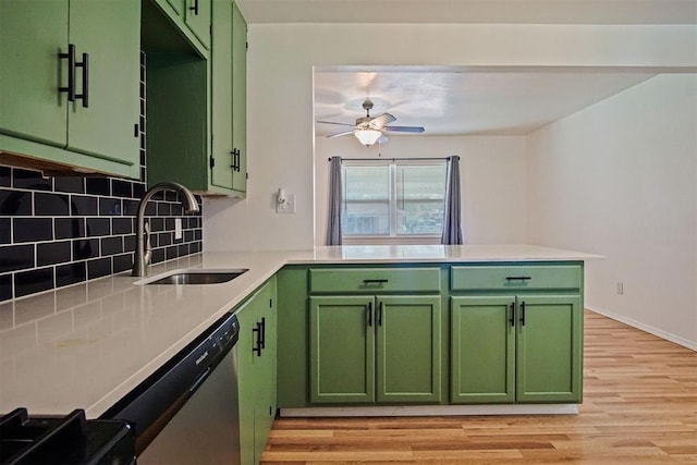 312 Jon St, Guthrie, OK 73044 - kitchen featuring green cabinetry, light wood-style floors, and dishwasher