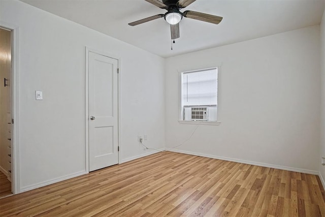 312 Jon St, Guthrie, OK 73044 - empty room with light wood-style flooring, cooling unit, and ceiling fan