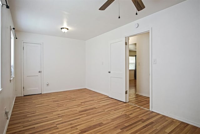 312 Jon St, Guthrie, OK 73044 - unfurnished room with ceiling fan, light wood-style floors, and a barn door