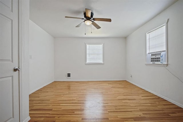 312 Jon St, Guthrie, OK 73044 - empty room with light wood finished floors, ceiling fan, and cooling unit