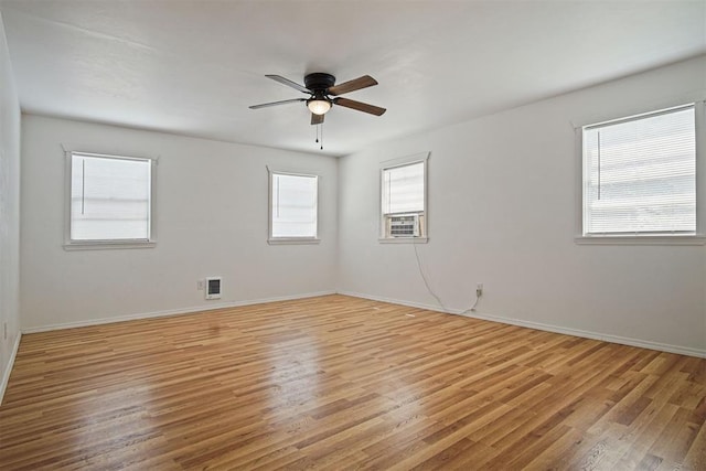 312 Jon St, Guthrie, OK 73044 - unfurnished room featuring light wood-type flooring, a ceiling fan, and cooling unit