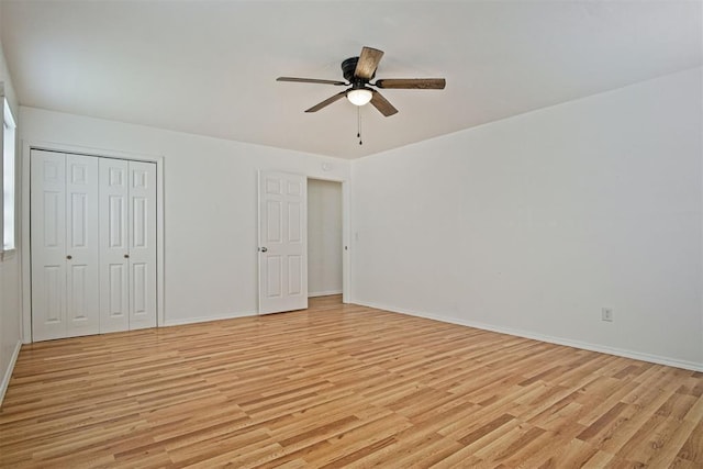 312 Jon St, Guthrie, OK 73044 - unfurnished bedroom with light wood-style floors, a closet, and a ceiling fan