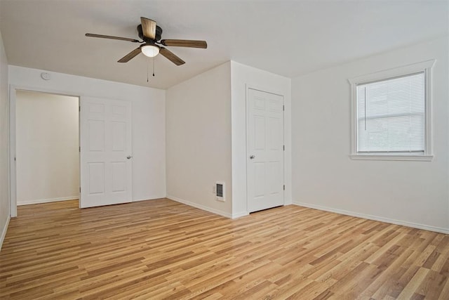 312 Jon St, Guthrie, OK 73044 - unfurnished bedroom with light wood finished floors and a ceiling fan