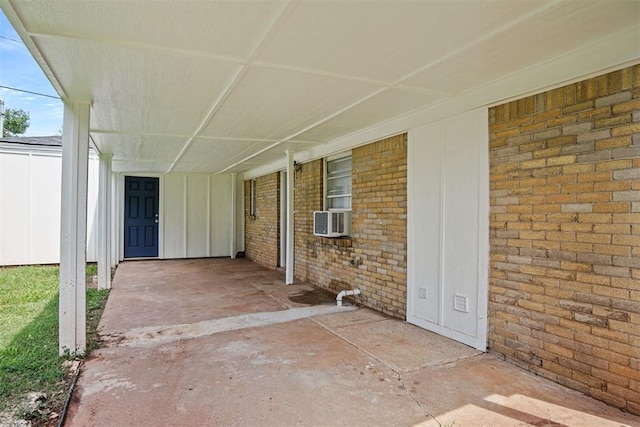 312 Jon St, Guthrie, OK 73044 - view of patio featuring cooling unit and a carport