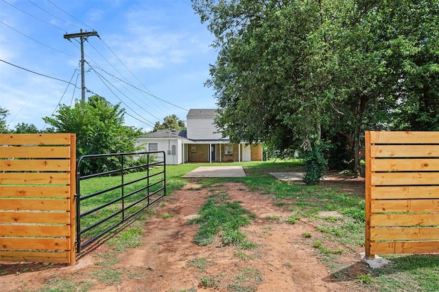 312 Jon St, Guthrie, OK 73044 - view of yard with a gate and an outbuilding